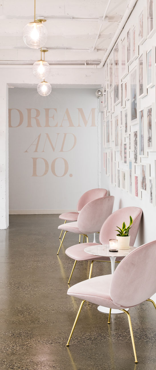 lobby with chairs and text that reads dream and do